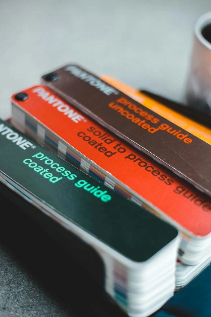 Pantone color guides representing creative design process