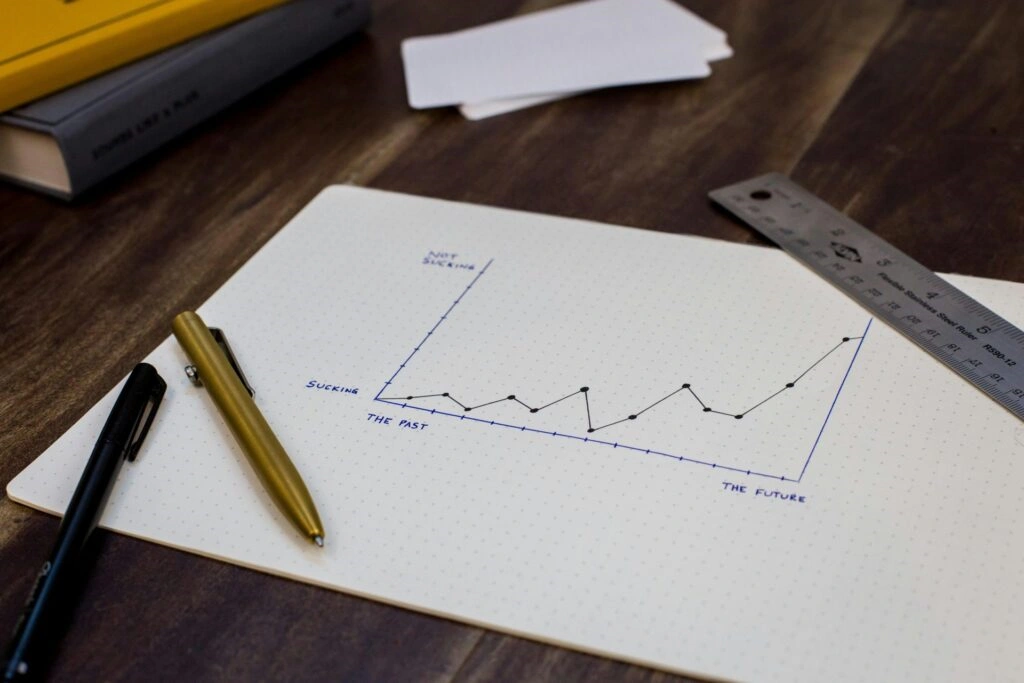 Responsive web design illustration - website traffic graph on notebook